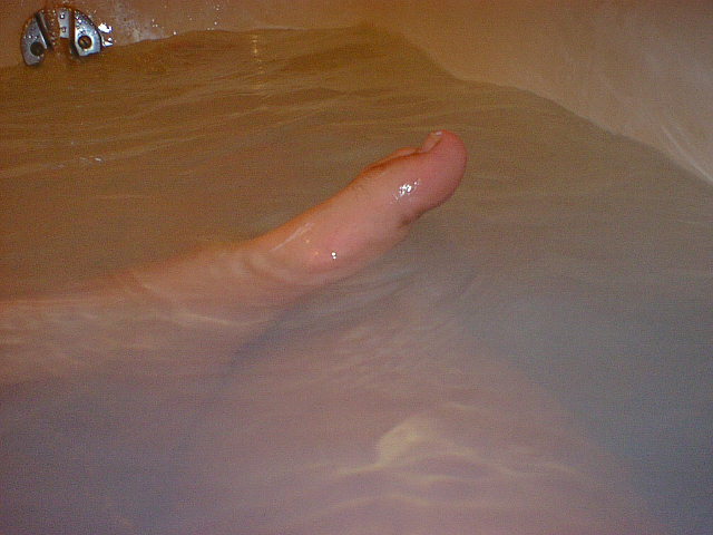 Playing with my feet in soapy water