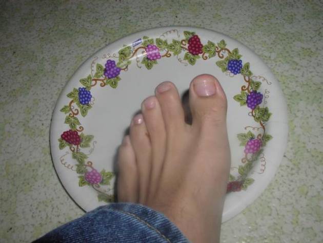 My feet on top of a plate