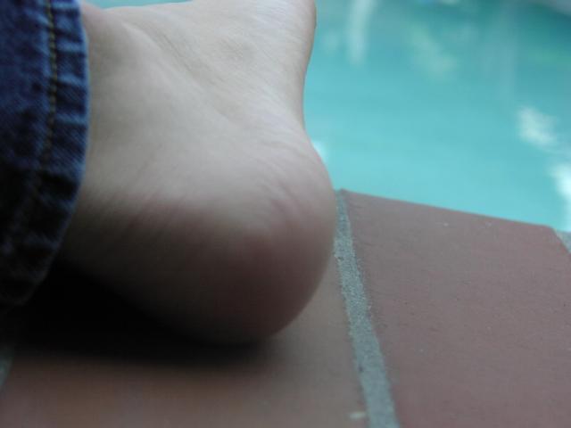 Feet near the pool