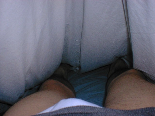 My legs and feet under covers