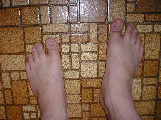 Showing bare feet in bathroom