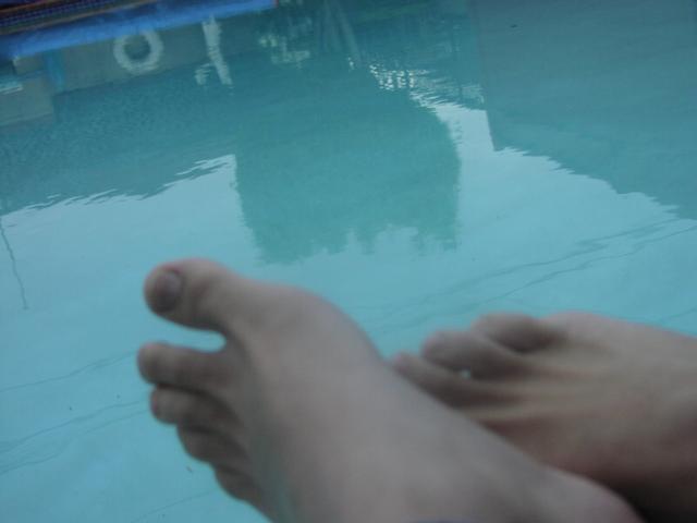 Lovely feet near the pool