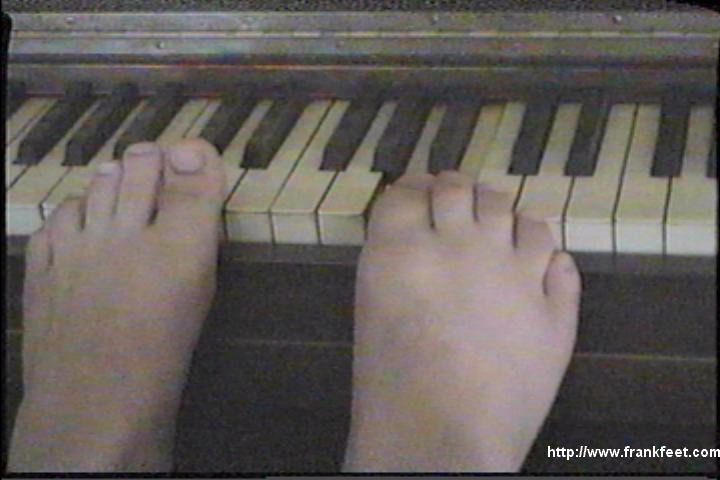 Playing a tune on a piano with my toes