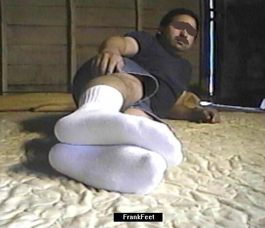 Laying down on the floor displaying socks