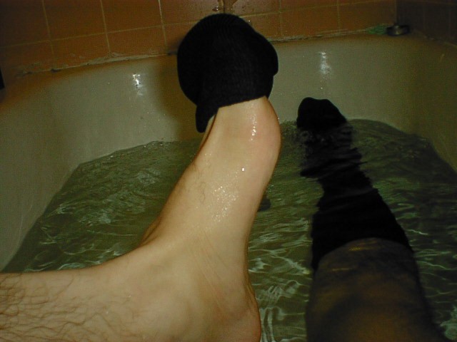 My wet socks being pulled off