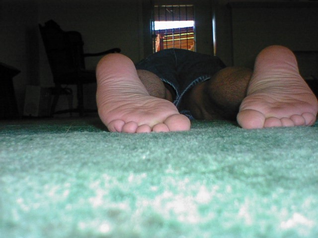 Laying on floor barefoot