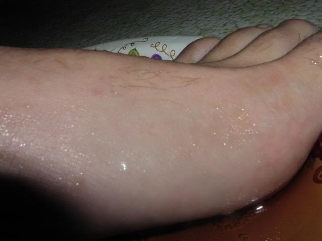 My feet covered with soda