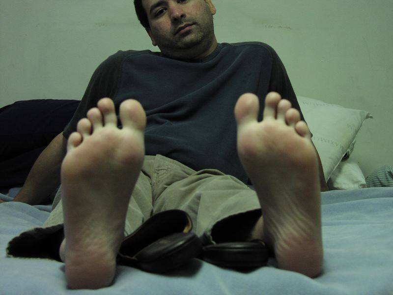 Franks feet resting on bed