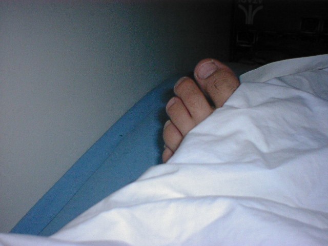 Toes peeking out from sheet